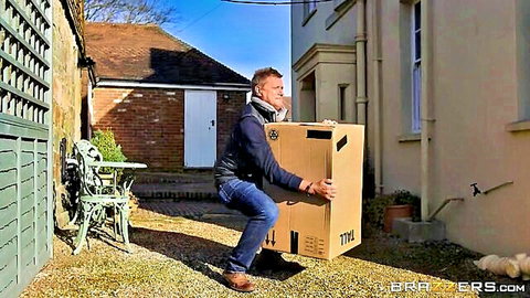 Hunky boyfriend lifting huge surprise box for GF, outdoor delivery tease
