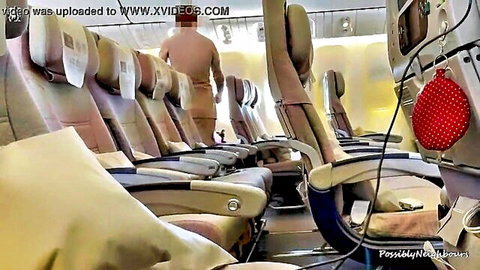 Blurry nude figure walking airplane aisle, mile high club tease