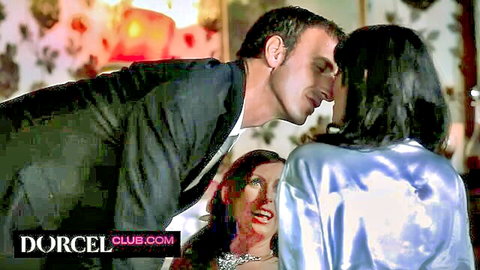 Two MILFs in silky robes kissing a suited man in steamy threesome