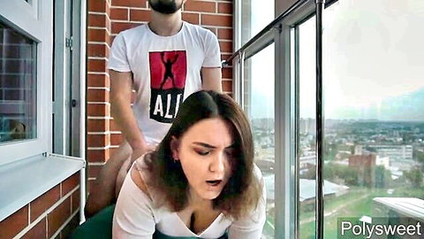 Shocked brunette fucked hard doggy style on balcony by bearded man