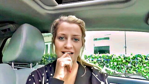 Sienna Day blonde model teasing with finger to lips in car
