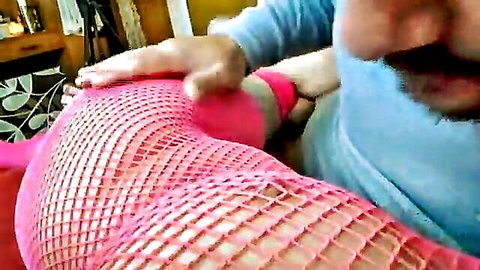 Sensual bareback fan sex with pink fishnet stockings and bearded man gripping thigh