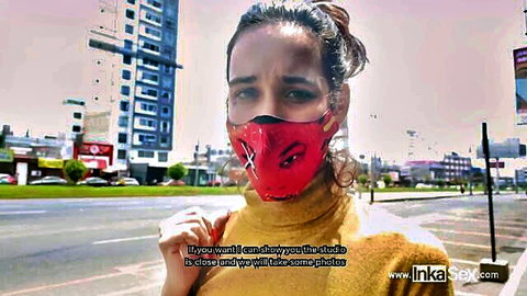 Venezuelan model in red X-mask and yellow top poses outdoors for Inka Sex photoshoot