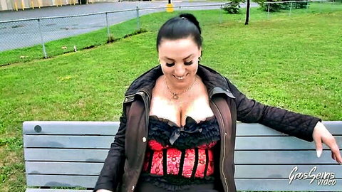 Hot MILF Fanny in red corset teases with big tits outdoors