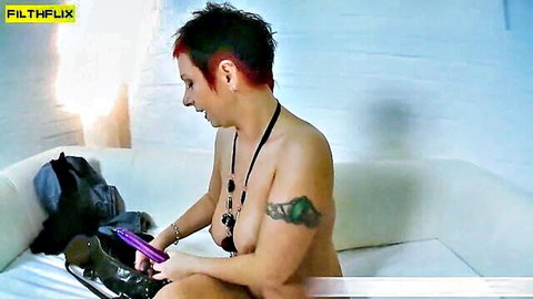 Mature redhead babe topless with tattoos using monster purple dildo