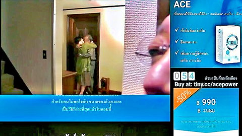 Asian couple in intimate doorway embrace, man sharing wife