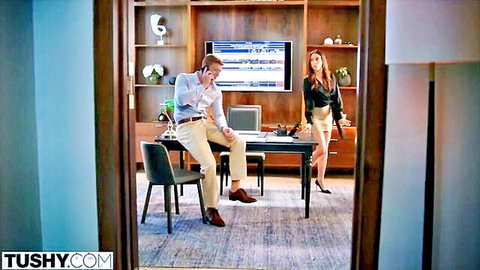 Brunette office employee in short skirt seducing boss on phone call