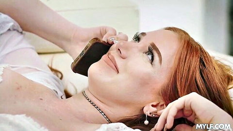 Madison Morgan redhead MILF lying in white dress on phone call