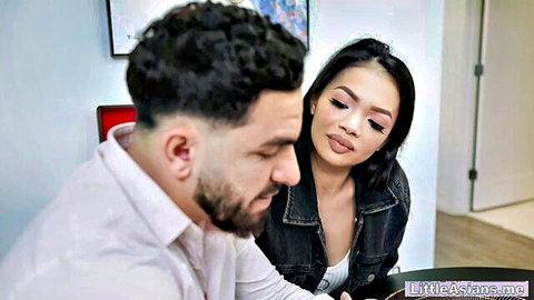 Petite Asian teen student acting dumb, close-up with handsome man in intimate gaze