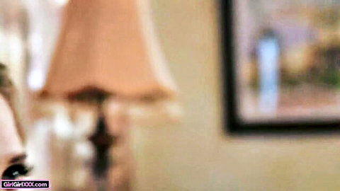 Blurry closeup of two fair-skinned skinny babes passionately kissing in bedroom
