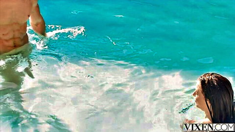 Tanned brunette beauty sucks muscular hunk's thick cock underwater in turquoise pool