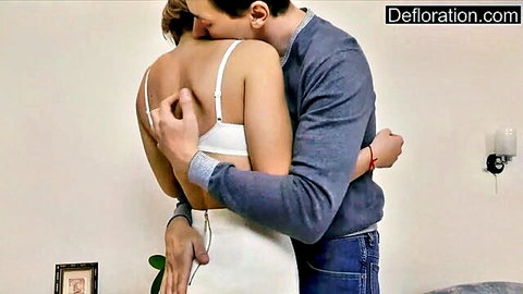 Guy passionately hugs and gropes brunette teen's tits in white bra from behind