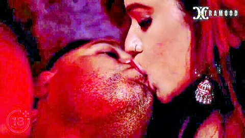 Passionate close-up kiss between nosering Indian babe and bearded hunk.