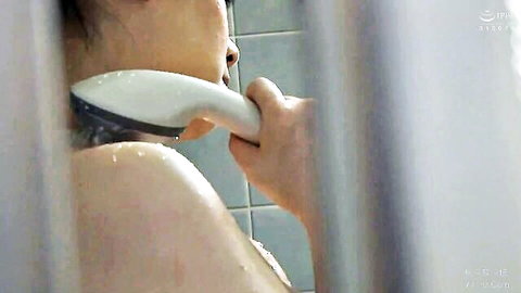Sensual Japanese woman in steamy shower rinsed on neck by man's hand