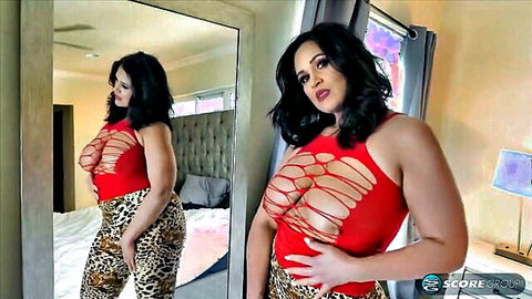 Kailani in revealing red top and leopard pants, curvy 46-32-46 figure posing