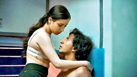 Sexy South Asian woman in white bra straddles topless Indian hunk in passionate cowgirl pose
