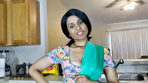 Naughty Indian MILF in low-cut floral blouse teasing deep cleavage in kitchen