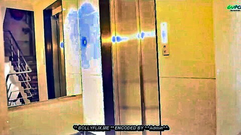 Blurry empty elevator lobby with mirrors stairs and Bollyflix watermark