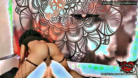 Shemale bends over exposing jeweled butt plug in her tight asshole with fishnet stockings