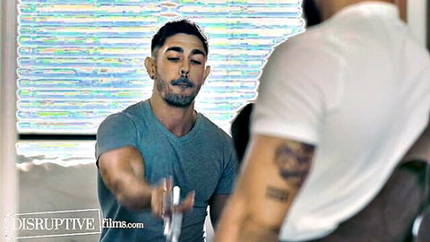 Muscular bearded jock in gray tee handed drink by tattooed man at B&B