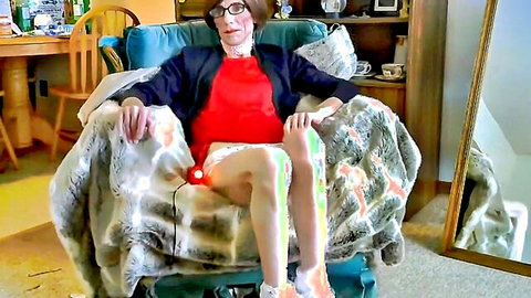 Skinny trans amateur in glasses spreads legs wide buzzing cock with red glowing vibrator on webcam