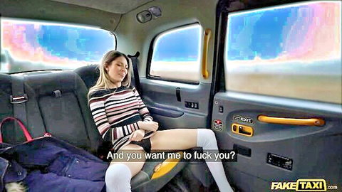 Blonde babe in Fake Taxi fingering pussy through pink panties in thigh high socks
