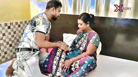 Bearded Indian man gropes mature busty MILF's crotch through colorful saree on bed