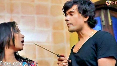 Indian couple in intense knife threat scene from Garmi series