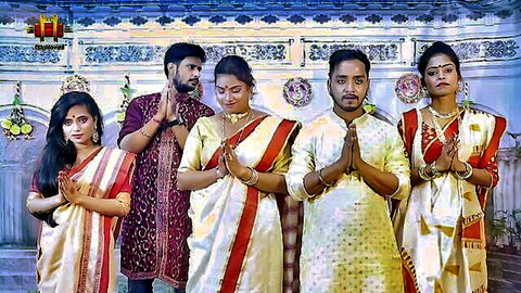 Alluring Indian women in sarees with men in traditional attire for threesome scene