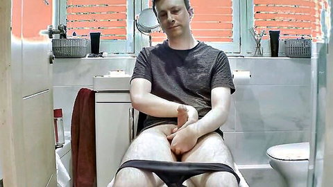 Gay white guy masturbating big cock in bathroom solo