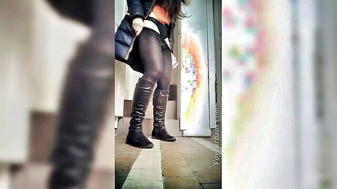 Voyeur upskirt of sexy white babe in tight pantyhose and thigh-high black boots teasing legs