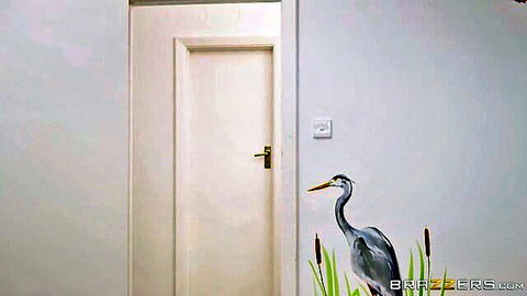 Elegant heron wall mural beside modern white door in artistic interior
