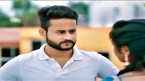 Indian man in polo shirt chats intimately with woman in blue top outdoors, Ullu series