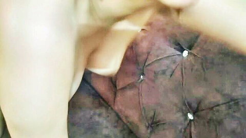Mistress Tatjana topless blonde dominatrix lounging seductively