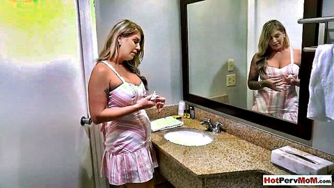 Lolly Dames blonde MILF in pink dress, big tits by mirror
