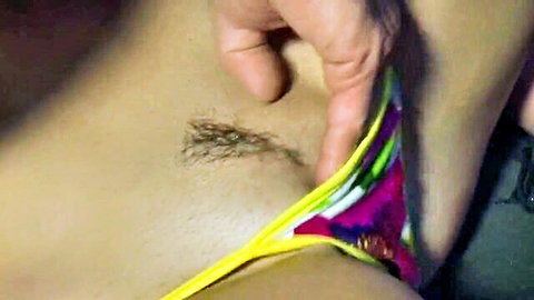 Alison Tyler's bush exposed as hand pulls colorful bikini aside
