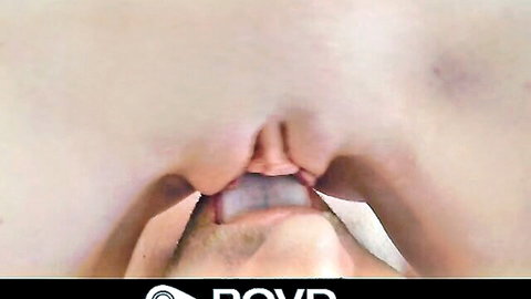 Close-up of gaping wet pussy spread wide by fingers with man's tongue licking inside