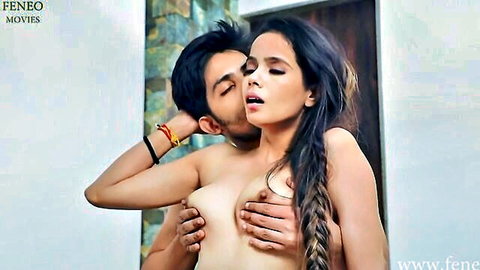 Indian teen couple in passionate topless embrace and kissing