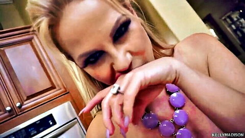 Kelly Madison teases topless in kitchen, big tits and seductive pose