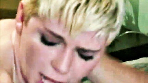 Blonde MILF's ecstatic face with eyes closed and wide open mouth during oral pleasure.