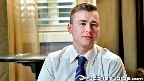 Handsome young man in white shirt and blue tie smiling seductively in Falcon Studios gay porn preview