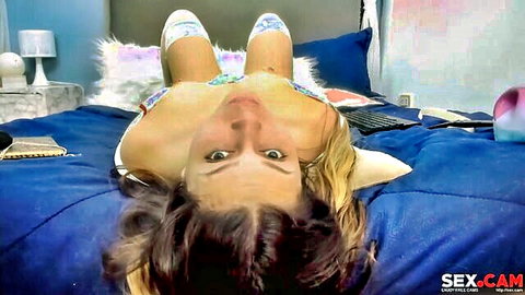 Blonde webcam babe upside down on bed spreads legs in white thigh-high stockings