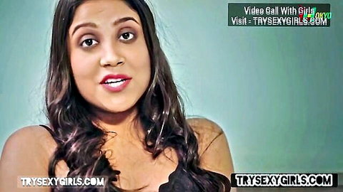 Seductive Indian beauty in video call, teasing with sultry gaze and cleavage