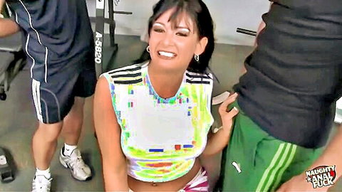 Dark-haired Hannah in gym threesome with fit guys teasing tight ass