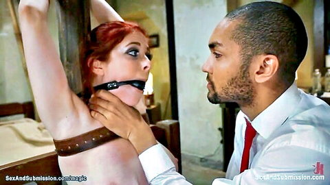 Bound redhead babe gagged and dominated by intense black hitman in BDSM thriller