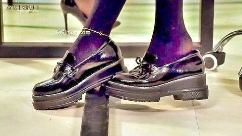 Sexy stockinged feet in shiny black platform loafers with bows tease for foot worship fetish
