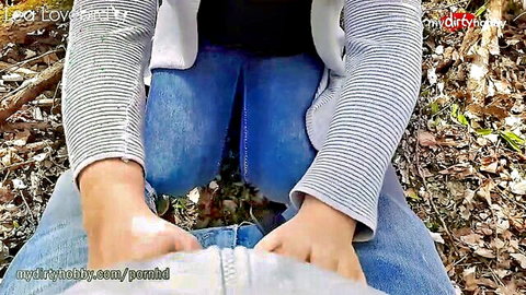 Curvy amateur girl spreads open jeans and fingers pussy outdoors in forest