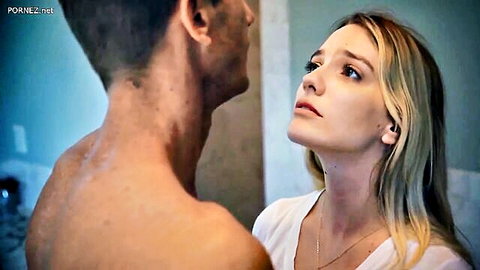 Blonde star Kenna James looks up at shirtless man in intimate close-up scene
