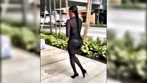 Curvy black celebrity lookalike in sheer black bodysuit flaunting big ass on street