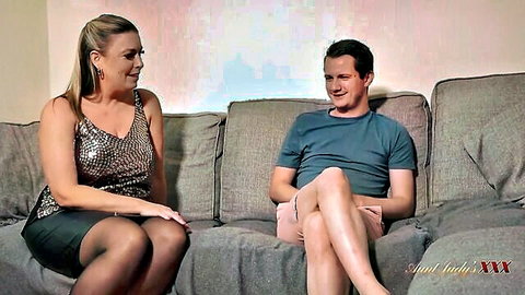 Maisie Lewis busty blonde BBW in stockings with man on couch